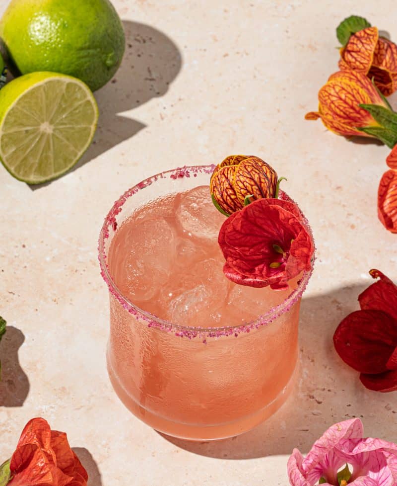 This refreshing floral cocktail is a twist on the classic margarita with the addition of a simple hibiscus syrup.